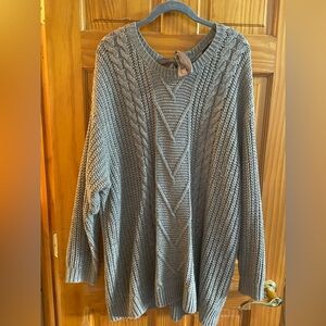 Gray sweater with “bow tie” in back.